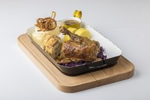 Roasted duck with rosemary and apples, served with red cabbage and an assortment of Czech dumplings